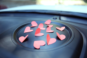 Paper hearts on car dashboard
