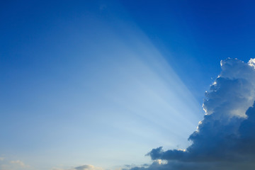 Naklejka na ściany i meble light rays on clear blue sky background