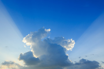 Naklejka na ściany i meble light rays explosion on clear blue sky with cloud