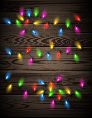 Color lights on wooden background.