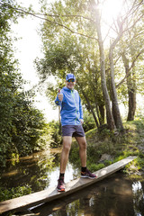 young man jogging at the woods