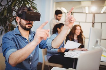 businessman gesturing while using virtual reality 