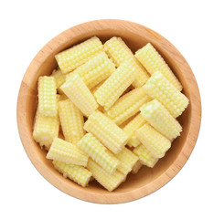 top view of young corn in wooden bowl isolated on white