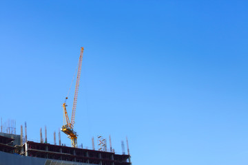 Fototapeta na wymiar machinery crane in construction site building