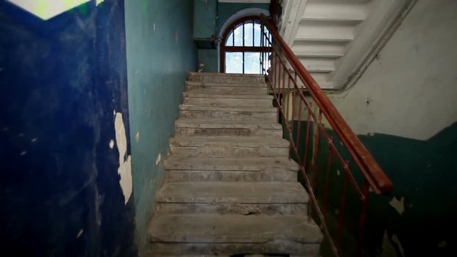 Views of a russian town. Old staircase in the stairwell of a multistory residential building. HD