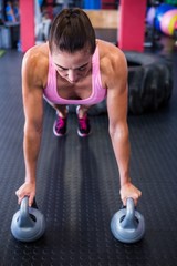 Female athlete doing push-ups 