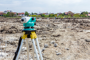 Geodesist device on a building site. Civil engineer with theodol