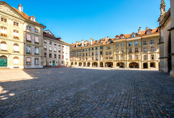 Fototapeta premium View on the city square with historical buildings near Munster church in the old town of Bern