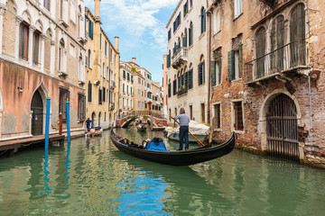Obraz na płótnie Canvas Gondolier rides gondola.