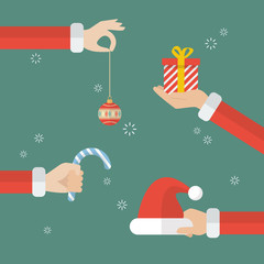 Santa claus hand holding christmas objects