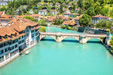 Fototapeta na wymiar Cityscape view on the old town with Aare river and old bridge in Bern city in Switzerland