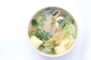 Thai style Seaweed soup with Bean Curd , mixed vegetable, Tofu  in white bowl on white background. Vegetarian Food, Healthy food, Thai food