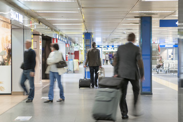 airport terminal, departure sector, people walking
