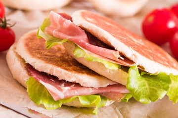 Tigella bread stuffed with ham and lettuce.