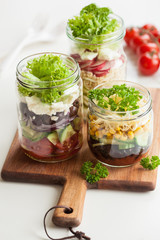 healthy vegetable cheese salad in mason jars