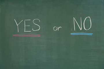 YES or NO written on the chalkboard