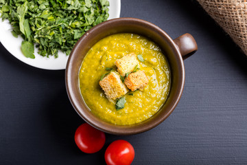 Green squash soup with parsley and croutons