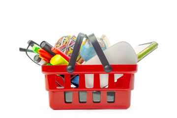Fototapeta premium Multiple office tools in a shopping cart, isolated on white background