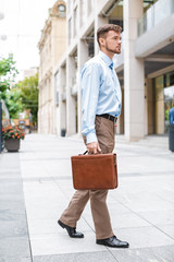  businessman walks with briefcase