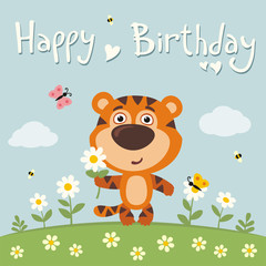 Obraz na płótnie Canvas Happy birthday! Cute tiger with flower camomile on flower meadow. Birthday card.