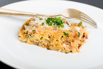 Vegetables casserole with cheese and chives