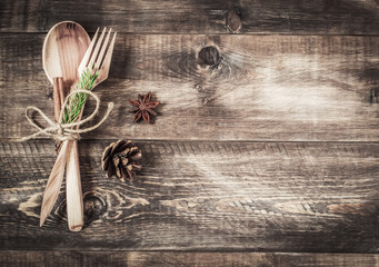 Background wooden cutlery and fir-cone