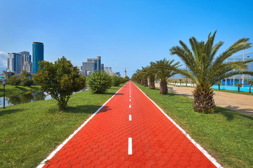 Obraz premium Long red bicycle road going far ahead in Batumi, Georgia