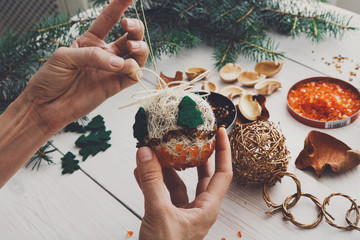 Creative diy hobby. Handmade craft christmas decoration, balls and garland