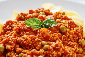 Close up tagliatelle with Bolognese sauce in white dish