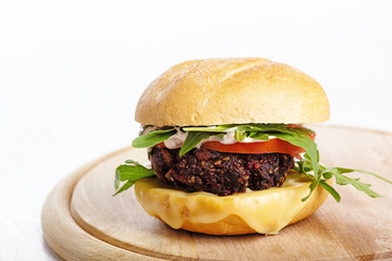 Vegetarian burger with cheese and vegetables