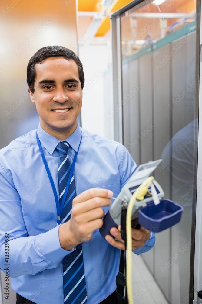 Poster portrait of technician using digital cable analyzer
