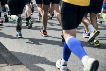 Legs of running people