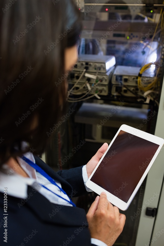 Aufkleber technician using digital tablet