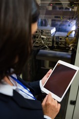 Technician using digital tablet