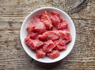 bowl of raw diced beef meat, from above