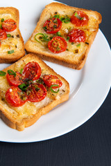 Grilled toast with camembert and cherry tomatoes