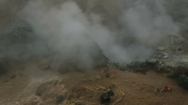 Boiling water in basin of active volcano Mutnovsky.