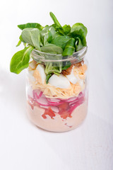 Glass jar with fresh salad