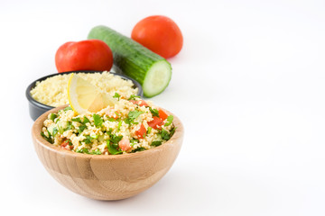 Tabbouleh salad with couscous and vegetables isolated on white background


