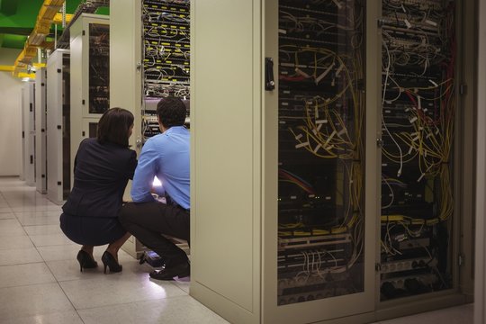 Technicians analyzing server