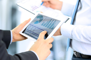 business colleagues working together and analyzing financial fig