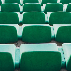 Green chairs on the stadium