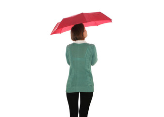 Girl with red umbrella and sweater on a white background, view from behind 