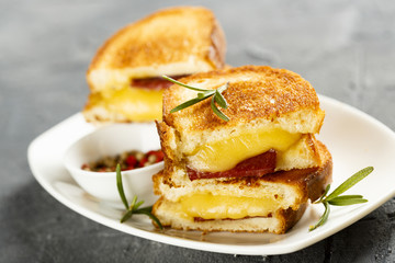 Toasts with cheese and sausage