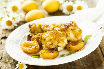 Chicken legs baked with apricots