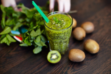 Fresh green smoothie with kiwi and mint . Love for a healthy raw food concept. Healthy eating. Fruit Smoothies. Kiwi.