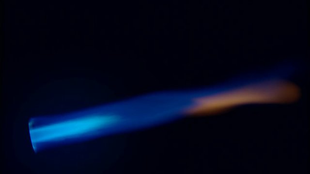 Blue flame against black background
