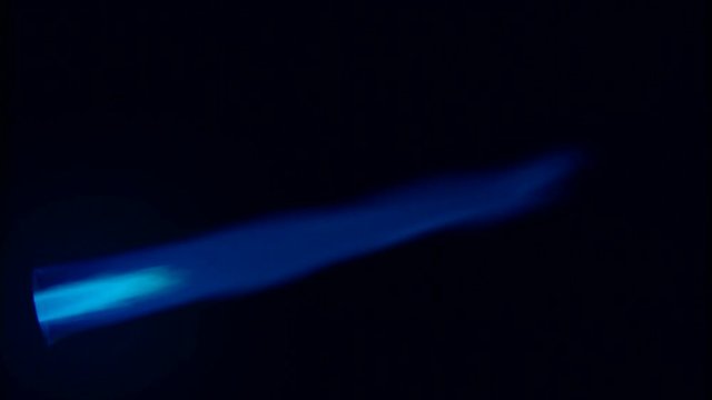 Butane flame isolated against black background
