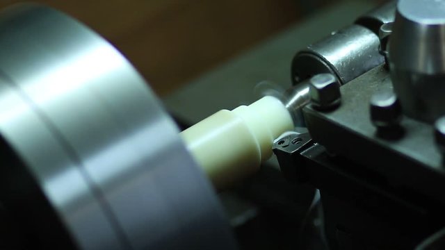 Close up turning lathe in action