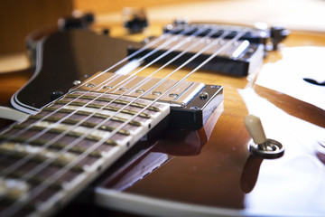 Fototapeta na wymiar Acoustic guitar close up in dark background